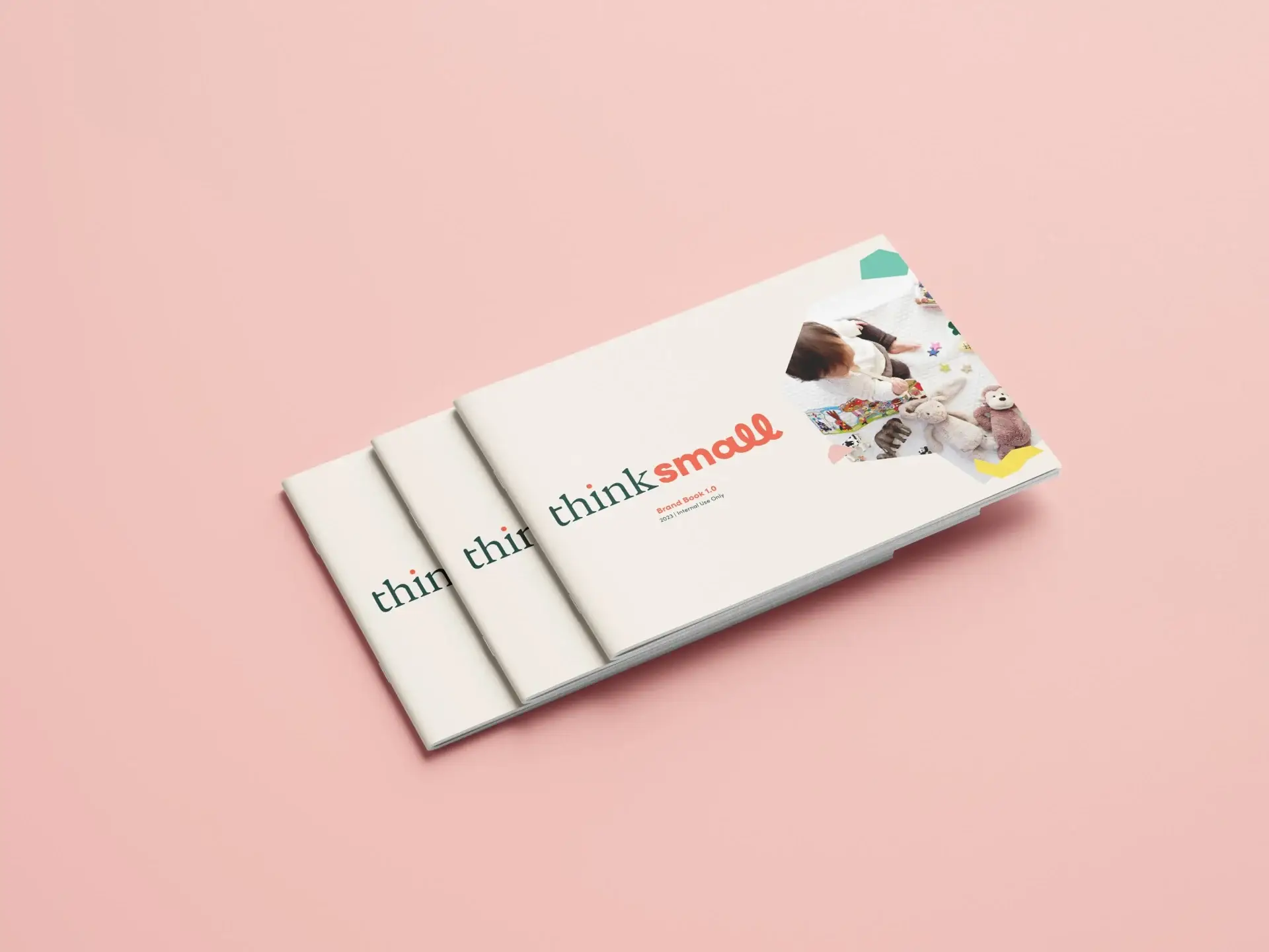 Think Small brand book mockup on a pink background, showcasing early childhood branding, visual identity, and creative direction.